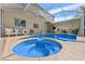 Gorgeous pool with integrated spa and covered lanai, creating a perfect setting for leisure and entertainment at 13003 Carlington Ln, Riverview, FL 33579