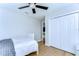 Bright bedroom with wood floors, a closet, and modern minimalist decor at 13118 Payton St, Odessa, FL 33556