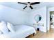 Clean bedroom with wood floors and a decorative gold mirror over a wall mounted vanity at 13118 Payton St, Odessa, FL 33556