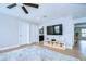 Bonus room with a ceiling fan, TV and a view of an en-suite bathroom at 13118 Payton St, Odessa, FL 33556