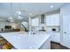 A spacious kitchen with pendant lighting and a large island offering seating and ample counter space at 13118 Payton St, Odessa, FL 33556