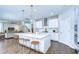 Spacious kitchen with a large center island, barstool seating, and open views to the living area at 13118 Payton St, Odessa, FL 33556