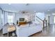 Large living room with hardwood floors, ceiling fan, tv and staircase at 13118 Payton St, Odessa, FL 33556