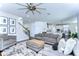 Open-concept living room featuring neutral tones, stairs, and easy access to the kitchen at 13118 Payton St, Odessa, FL 33556