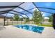 Gorgeous screened-in pool offering clear blue water and serene surroundings for ultimate relaxation and enjoyment at 13118 Payton St, Odessa, FL 33556