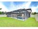 Beautiful screened-in pool with manicured lawn offering a private outdoor oasis for relaxation and enjoyment at 13118 Payton St, Odessa, FL 33556