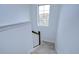 Staircase with carpeted steps and a wooden banister leading to the second floor at 13118 Payton St, Odessa, FL 33556
