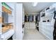 Spacious walk-in closet features custom shelving, drawers, and ample hanging space for organized storage at 13118 Payton St, Odessa, FL 33556