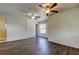 Spacious bedroom with hardwood floors and two ceiling fans at 1402 Provincetown Cir, Lutz, FL 33549