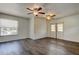 Bright bedroom featuring two ceiling fans and hardwood floors at 1402 Provincetown Cir, Lutz, FL 33549