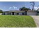 Single-story home with well-kept lawn, presenting a welcoming and traditional aesthetic at 1402 Provincetown Cir, Lutz, FL 33549