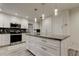 This updated kitchen features an island, stainless steel appliances, and elegant countertops at 1402 Provincetown Cir, Lutz, FL 33549