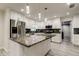 Bright kitchen with granite counters, stainless appliances and white cabinetry at 1402 Provincetown Cir, Lutz, FL 33549