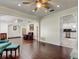 Open-concept living room featuring hardwood floors and stylish decor with seamless transitions to other rooms at 1402 Provincetown Cir, Lutz, FL 33549