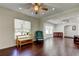 A bright and open living room with hardwood floors and ample natural light at 1402 Provincetown Cir, Lutz, FL 33549