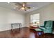 This living room has hardwood floors, crown molding, and natural lighting at 1402 Provincetown Cir, Lutz, FL 33549