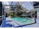 Enclosed backyard swimming pool featuring a spacious deck area for outdoor enjoyment at 1402 Provincetown Cir, Lutz, FL 33549
