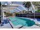 A long, enclosed pool area perfect for relaxation and recreation at 1402 Provincetown Cir, Lutz, FL 33549