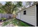 Backyard featuring a utility shed with windows and a door, great for storage or a workshop at 1402 Provincetown Cir, Lutz, FL 33549