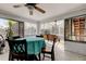 Inviting sunroom with a dining table and a swing, perfect for entertaining or relaxing at 1402 Provincetown Cir, Lutz, FL 33549