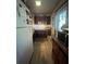 Narrow kitchen featuring wood cabinets, white refrigerator, and lots of natural light at 1420 36Th N Ave, St Petersburg, FL 33704