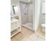 Bathroom with updated shower, tile flooring, and vanity at 1507 W Le Compte Dr, Tampa, FL 33604