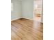 Bedroom with vinyl flooring and view into en suite bathroom at 1507 W Le Compte Dr, Tampa, FL 33604