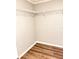 Walk-in closet featuring vinyl flooring and shelf storage at 1507 W Le Compte Dr, Tampa, FL 33604