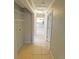Hallway with tile floors, leading to kitchen at 1507 W Le Compte Dr, Tampa, FL 33604