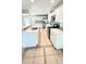 Bright kitchen features quartz counters, white cabinets, and stainless steel appliances at 1507 W Le Compte Dr, Tampa, FL 33604