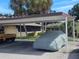 A covered carport and parking space in front of condo residences at 1508 16Th Se Cir, Largo, FL 33771