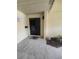Condo entrance featuring neutral paint, storm door, and welcome mat at 1508 16Th Se Cir, Largo, FL 33771