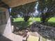 View of front yard with trees and green grass visible through the window at 1508 16Th Se Cir, Largo, FL 33771