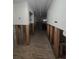 Hallway featuring renovated walls and flooring, under construction at 1508 16Th Se Cir, Largo, FL 33771