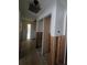 Hallway with renovated walls and flooring, featuring a closet with a sliding door at 1508 16Th Se Cir, Largo, FL 33771