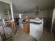 Unfinished living room with exposed framework, new tile flooring, and modern appliances at 1508 16Th Se Cir, Largo, FL 33771
