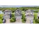 Aerial view of well-maintained homes with green lawns near a tranquil pond at 1634 Acadia Harbor Pl, Brandon, FL 33511
