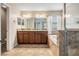 Bathroom with a double vanity sink, granite countertops and a separate tub, providing elegance at 1634 Acadia Harbor Pl, Brandon, FL 33511