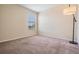 Cozy bedroom with natural light from a window, complemented by a stylish floor lamp at 1634 Acadia Harbor Pl, Brandon, FL 33511