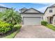 Charming two-story home with brick driveway and well-maintained landscaping at 1634 Acadia Harbor Pl, Brandon, FL 33511