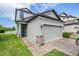 Charming two-story home features a two-car garage and manicured lawn at 1634 Acadia Harbor Pl, Brandon, FL 33511