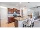 Modern kitchen features granite countertops, stainless steel appliances, and a stylish island with seating at 1634 Acadia Harbor Pl, Brandon, FL 33511