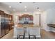 Well-appointed kitchen with a central island, granite countertops and modern appliances at 1634 Acadia Harbor Pl, Brandon, FL 33511