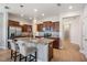This kitchen features granite countertops, stainless steel appliances and modern pendant lighting at 1634 Acadia Harbor Pl, Brandon, FL 33511