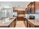 Spacious kitchen with granite countertops, stainless steel appliances and rich cabinetry at 1634 Acadia Harbor Pl, Brandon, FL 33511