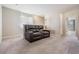 Upstairs loft area furnished with a leather loveseat, carpet, and natural light at 1634 Acadia Harbor Pl, Brandon, FL 33511
