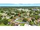 This aerial view shows the property's peaceful neighborhood and easy access to amenities at 1725 Pine Ridge E Way # E, Palm Harbor, FL 34684