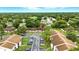 This aerial shot showcases the property's beautiful surroundings and well-kept landscaping at 1725 Pine Ridge E Way # E, Palm Harbor, FL 34684