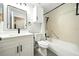 This bathroom features a tiled shower and floor, modern fixtures, and a new vanity sink at 1725 Pine Ridge E Way # E, Palm Harbor, FL 34684