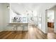 Stylish kitchen with modern white cabinets, stainless steel appliances, and an island with bar seating at 1725 Pine Ridge E Way # E, Palm Harbor, FL 34684